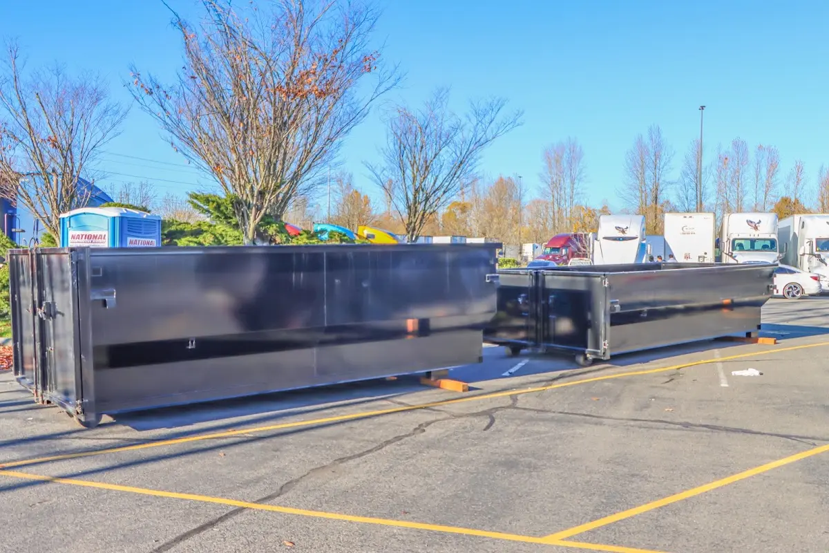 Professional dumpster rental service with roll-off container on residential driveway in Upper Leacock
